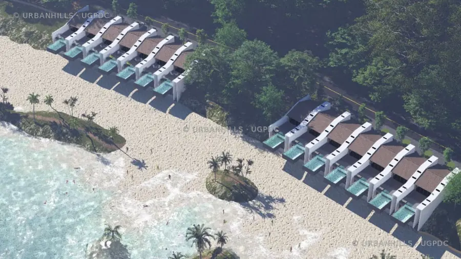 High aerial view of two coastal villa clusters positioned beside a beach